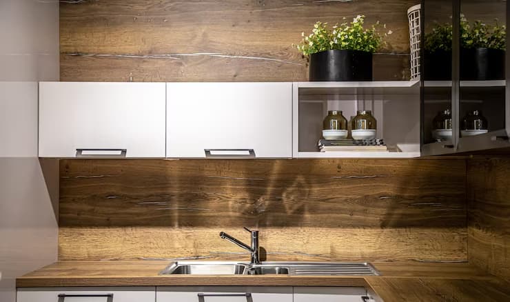 Modern wooden kitchen interior with steel faucet