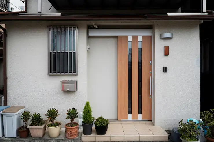 Japanese culture house entrance with plants and pots