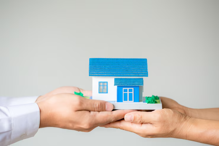Real estate broker presenting insurance form agreement to client