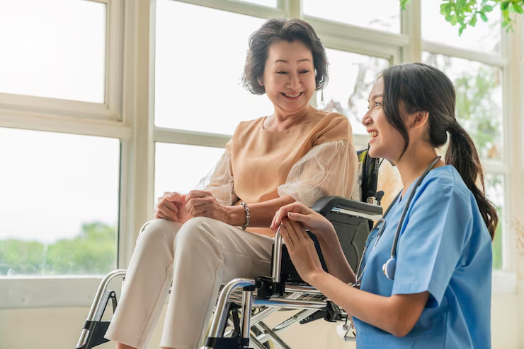 Caregiver assisting elderly patient with medical needs
