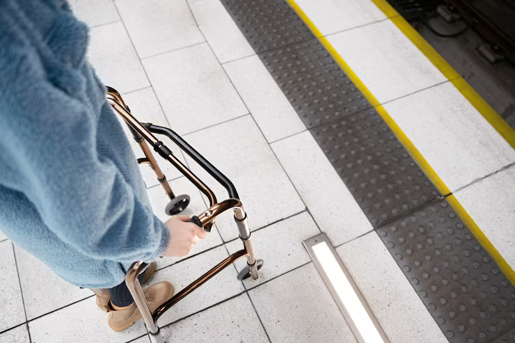 Hands holding a walking frame viewed from high angle