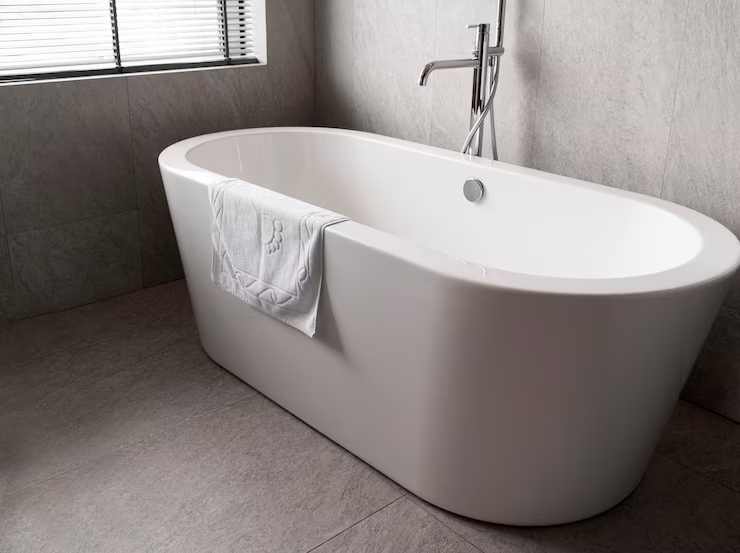 Minimalistic white bathtub with towel