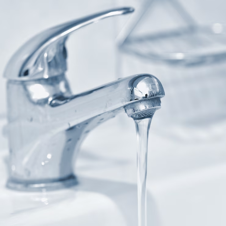 Close-up of clear water running from a tap